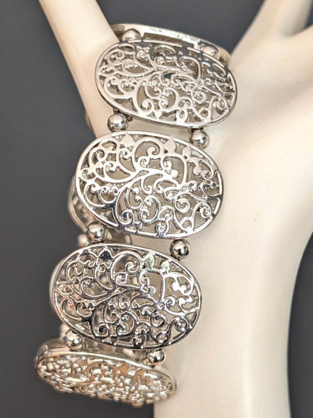 Silver tone open work panel stretch bracelet